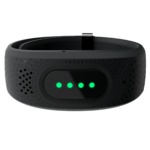 Black wearable device with glowing green LED lights, viewed from the top.