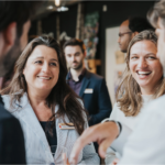 Two people in conversation at a professional networking event