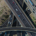 Aerial view of highway intersection with cars