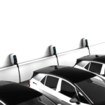 Electric vehicles charging in a parking garage.