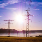 Power plants describing Wegatech at sunrise over a misty field